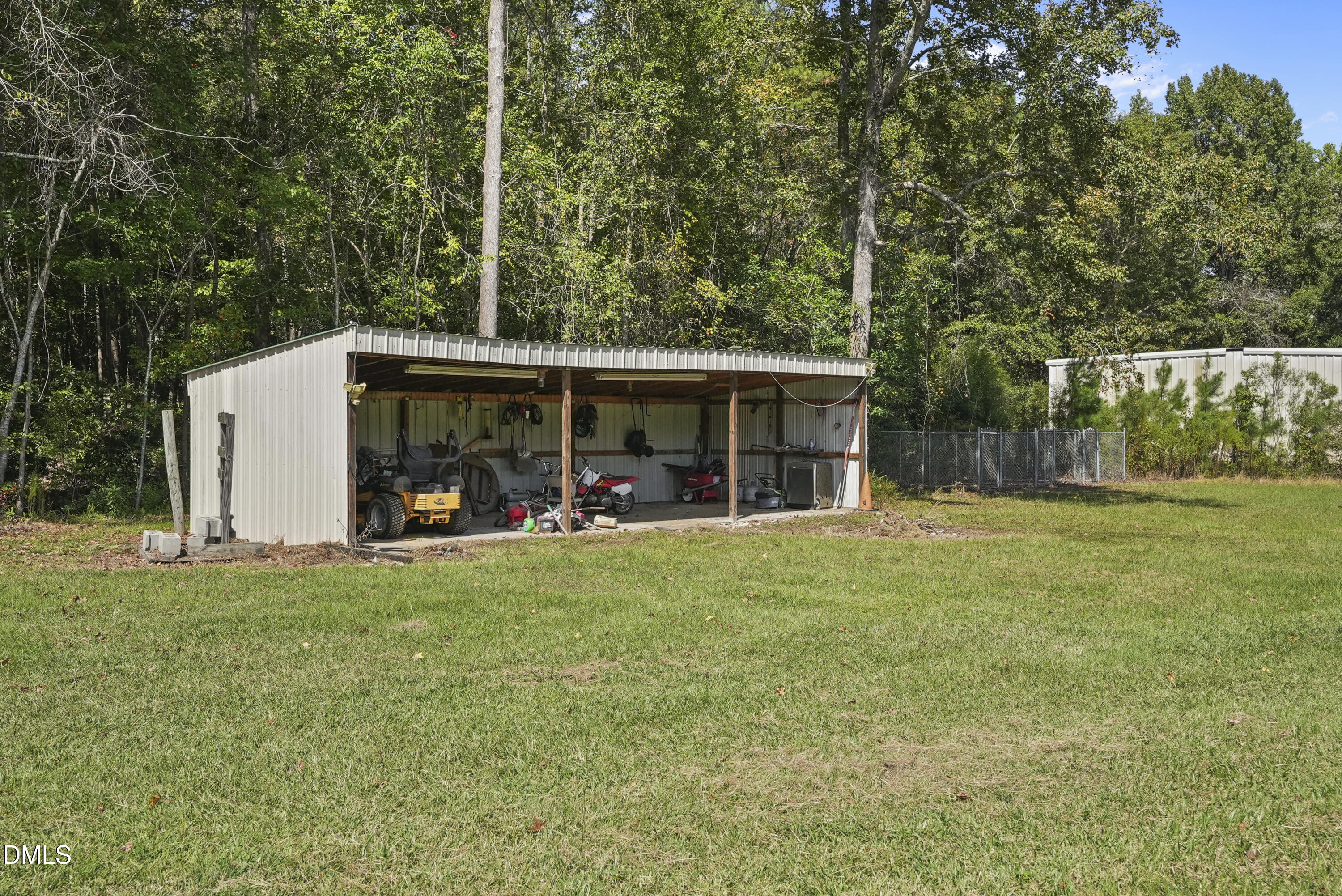 700 Mann Road Coats, NC 27521 - Photo 31 of 35 a view of a house with backyard porch and garden