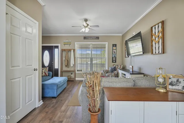 a view of a livingroom with furniture and window