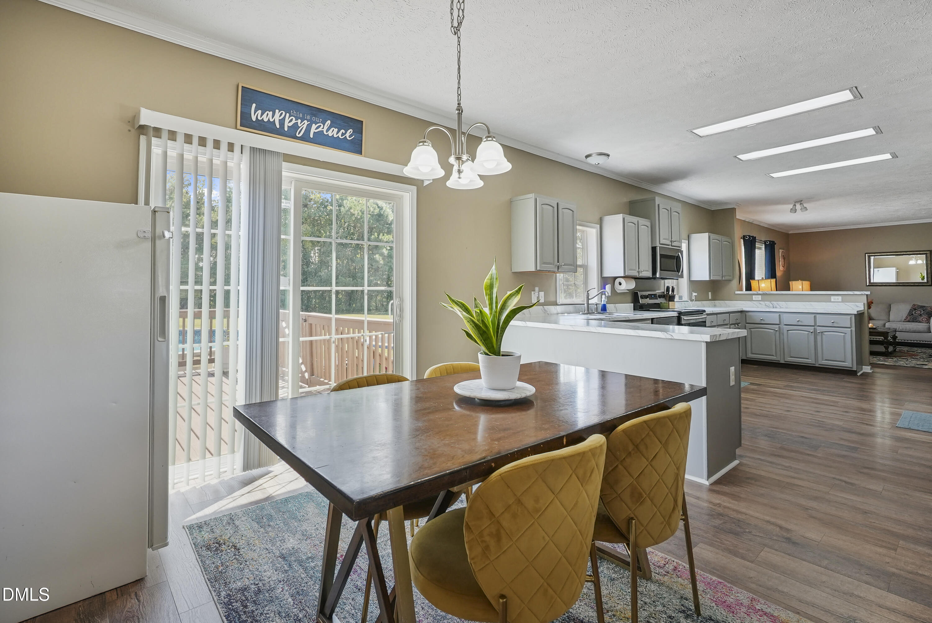 700 Mann Road Coats, NC 27521 - Photo 5 of 35 a view of a dining room with furniture and wooden floor