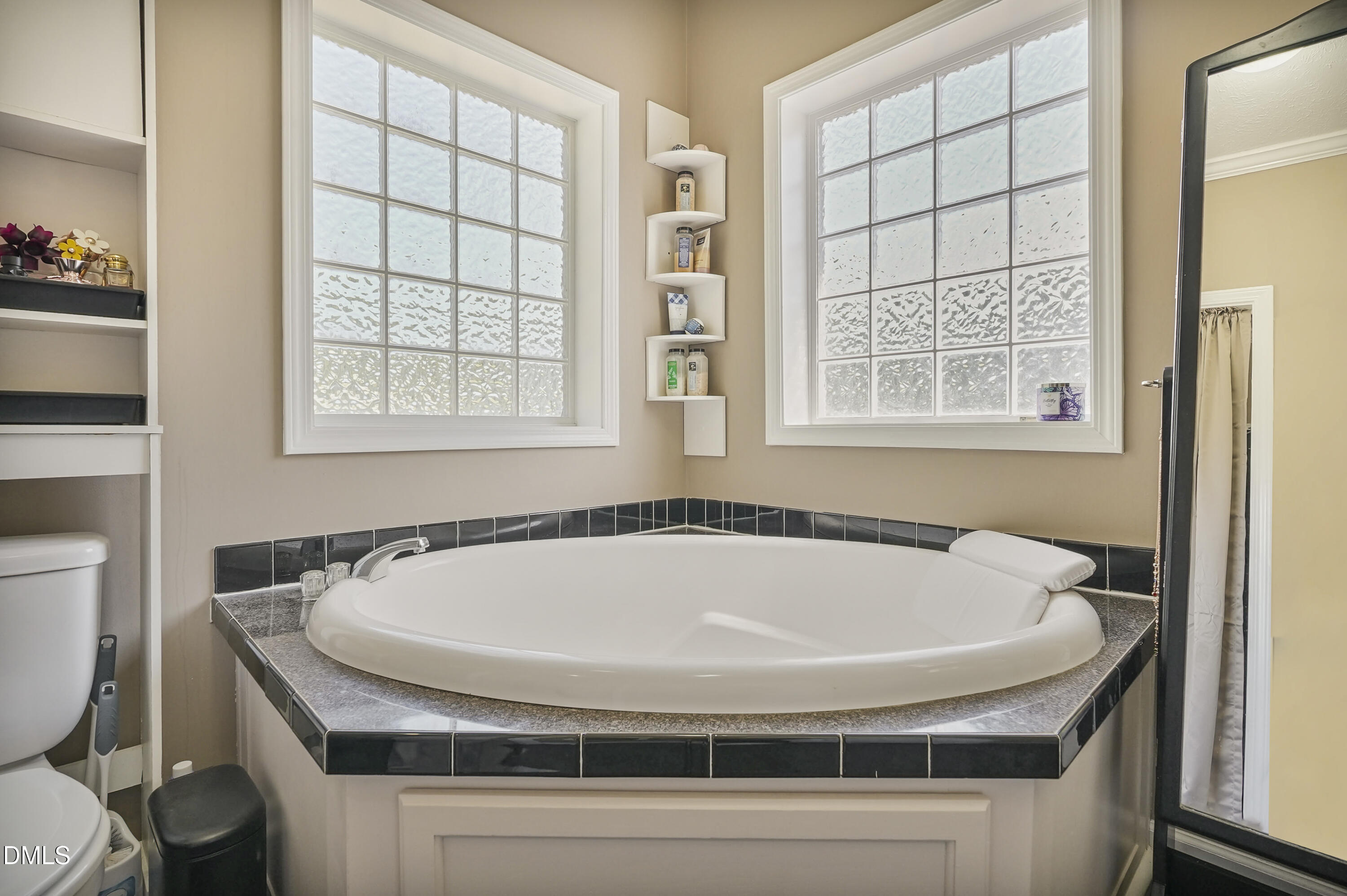 700 Mann Road Coats, NC 27521 - Photo 9 of 35 a bathroom with a tub and a window