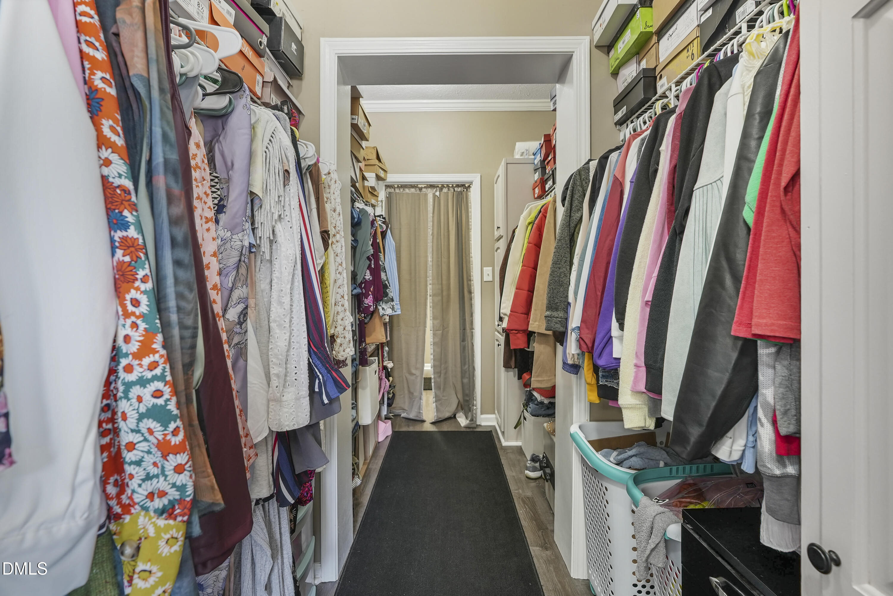 700 Mann Road Coats, NC 27521 - Photo 10 of 35 a view of walk in closet with clothes and shoes