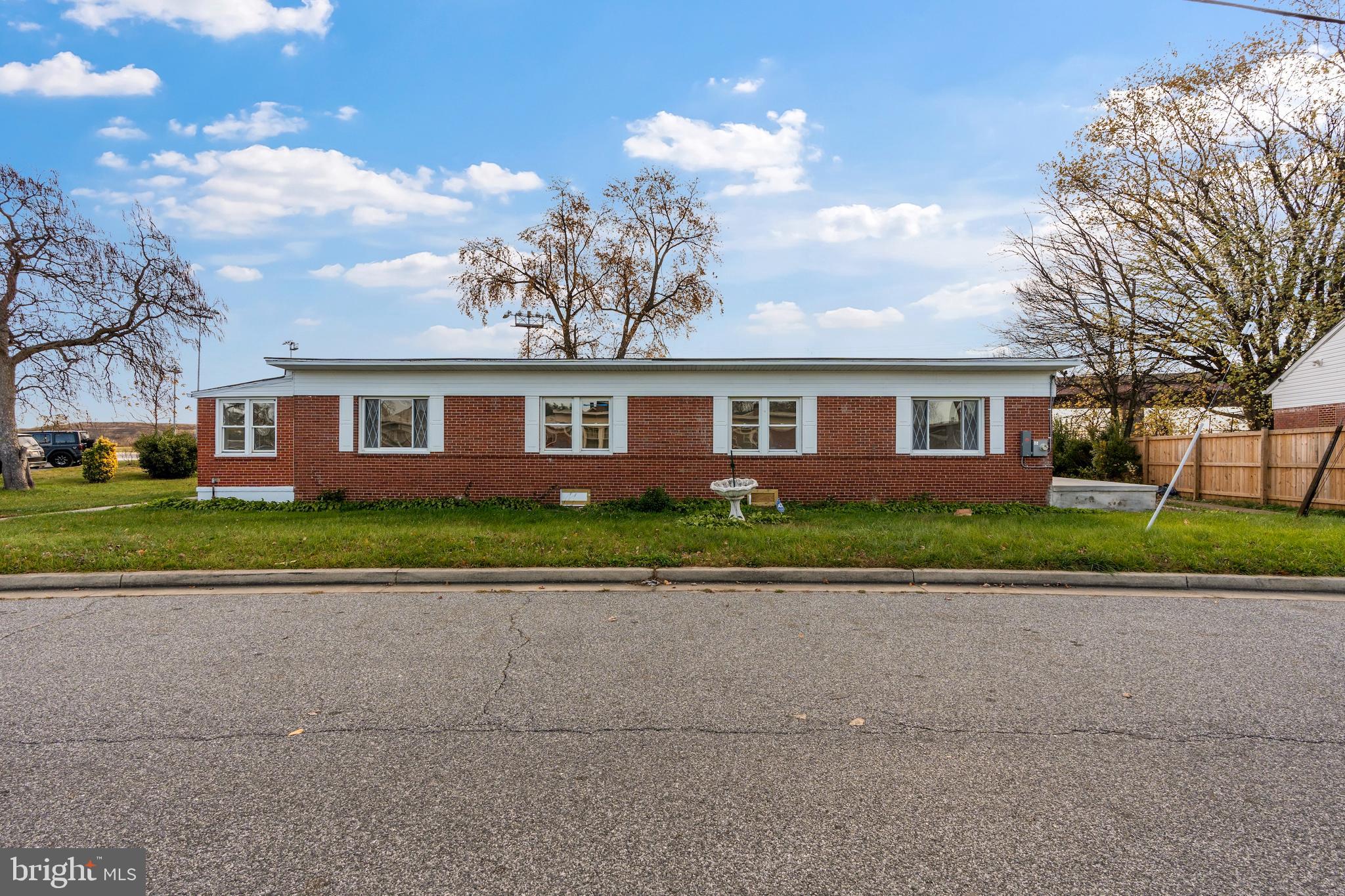 730 New Pittsburg Avenue, Unit 2 Baltimore, MD 21222 - Photo 1 of 27 front view of house with a yard