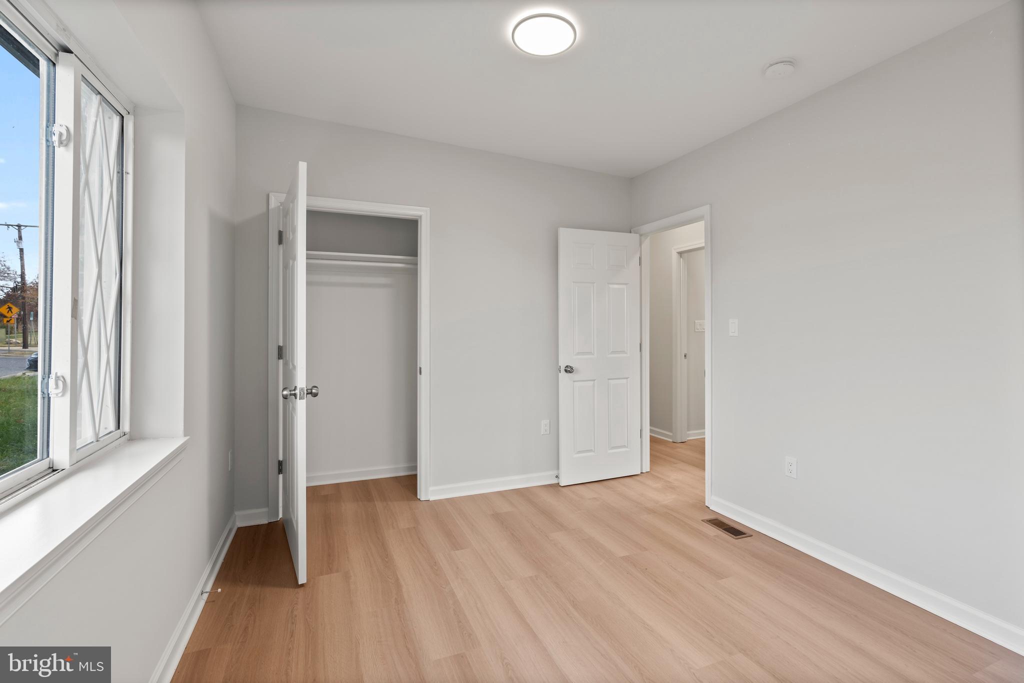 730 New Pittsburg Avenue, Unit 2 Baltimore, MD 21222 - Photo 15 of 27 a view of a room with wooden floor and windows
