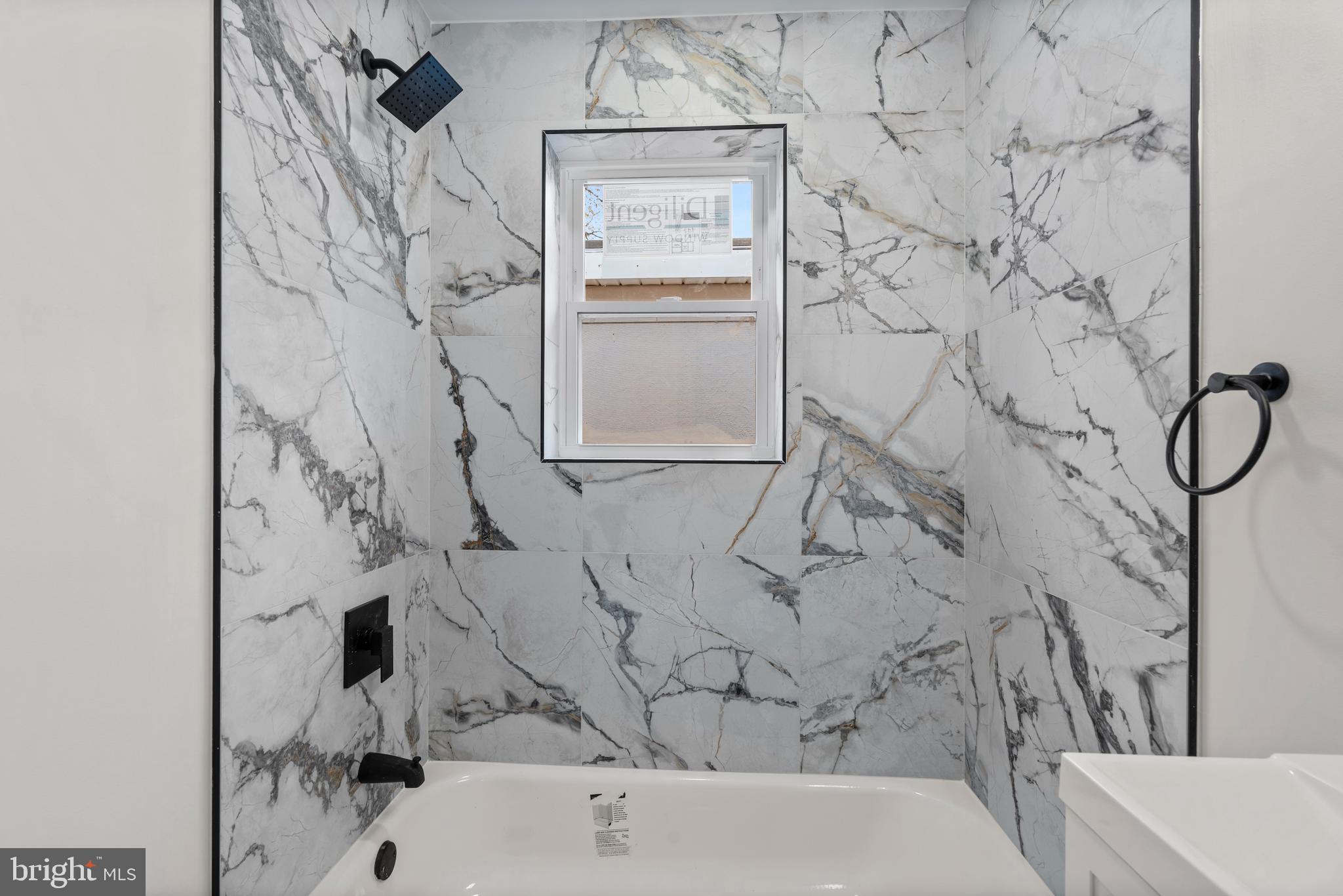 730 New Pittsburg Avenue, Unit 2 Baltimore, MD 21222 - Photo 17 of 27 a bathroom with a bathtub and shower