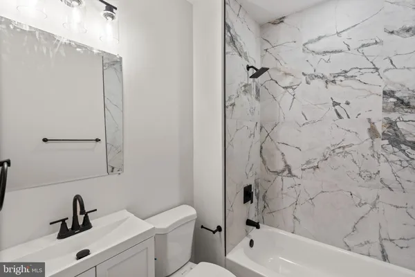 a bathroom with a sink and a bathtub