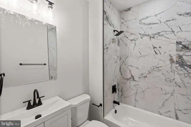 a bathroom with a sink and a bathtub