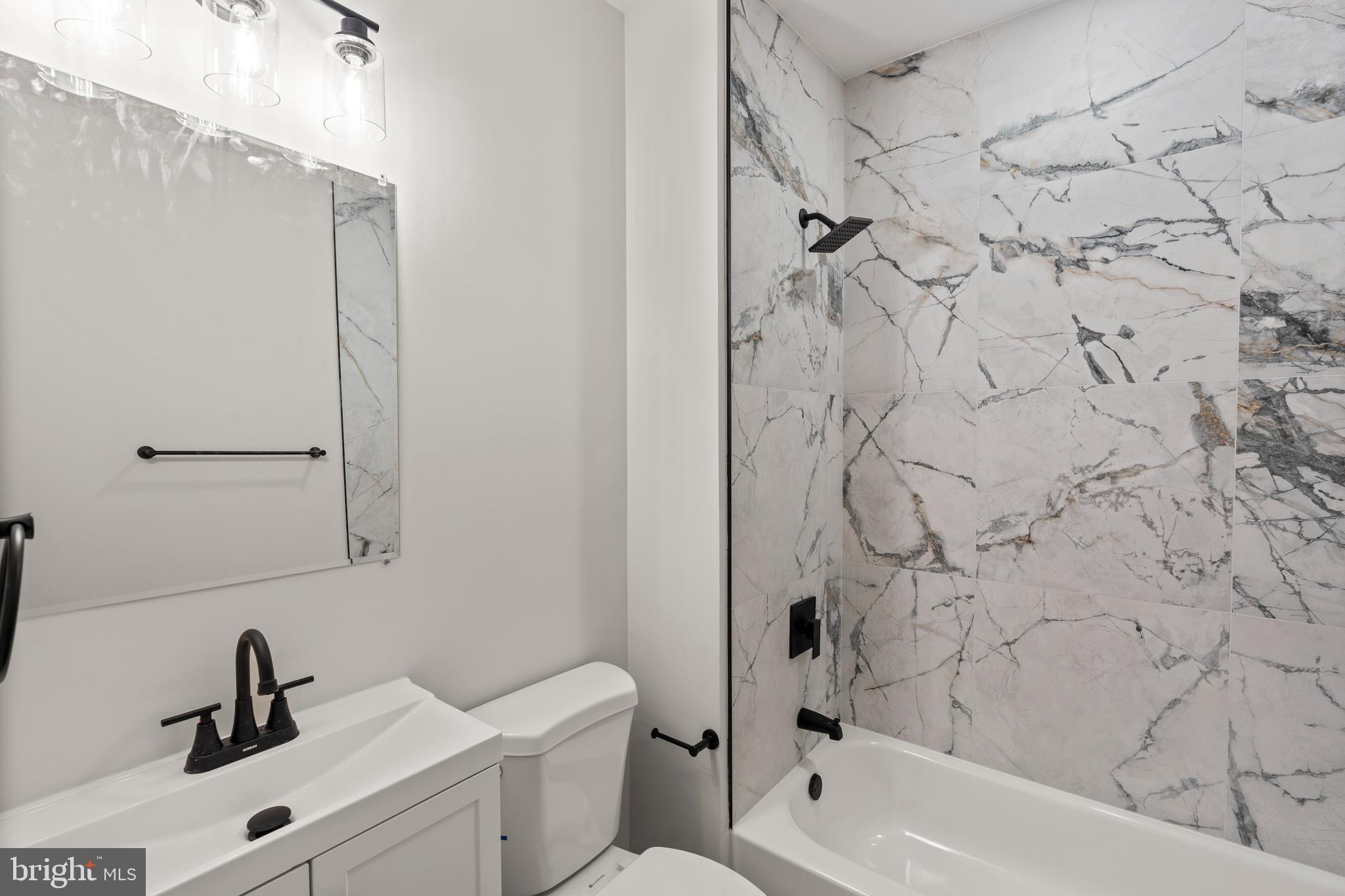 730 New Pittsburg Avenue, Unit 2 Baltimore, MD 21222 - Photo 20 of 27 a bathroom with a sink and a bathtub