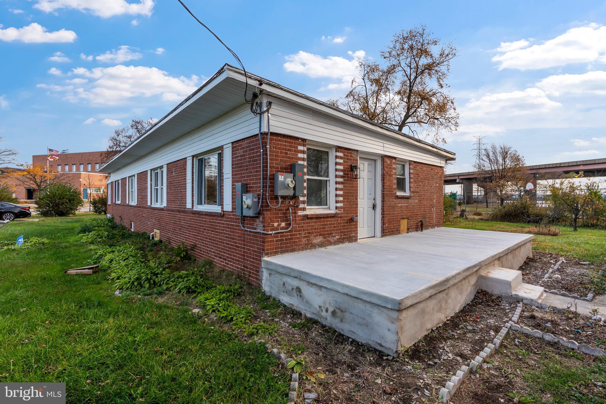 730 New Pittsburg Avenue, Unit 2 Baltimore, MD 21222 - Photo 22 of 27 a front view of a house with garden