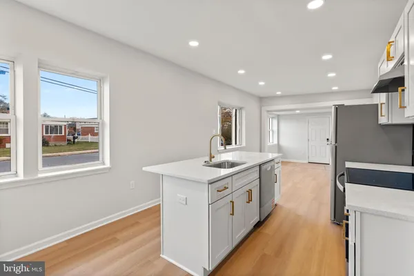 a kitchen with a stove and a sink