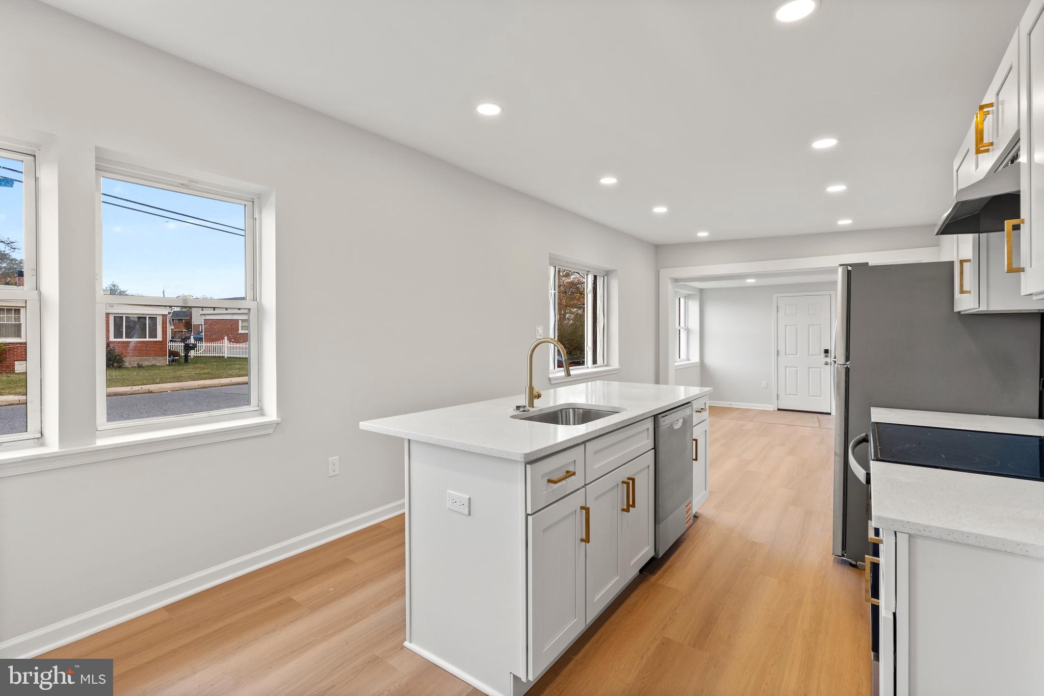 730 New Pittsburg Avenue, Unit 2 Baltimore, MD 21222 - Photo 3 of 27 a kitchen with a stove and a sink