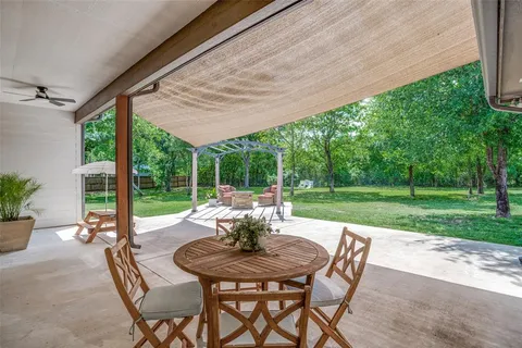 a view of yard with patio