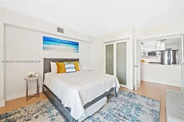 a bedroom with a bed and a cabinets