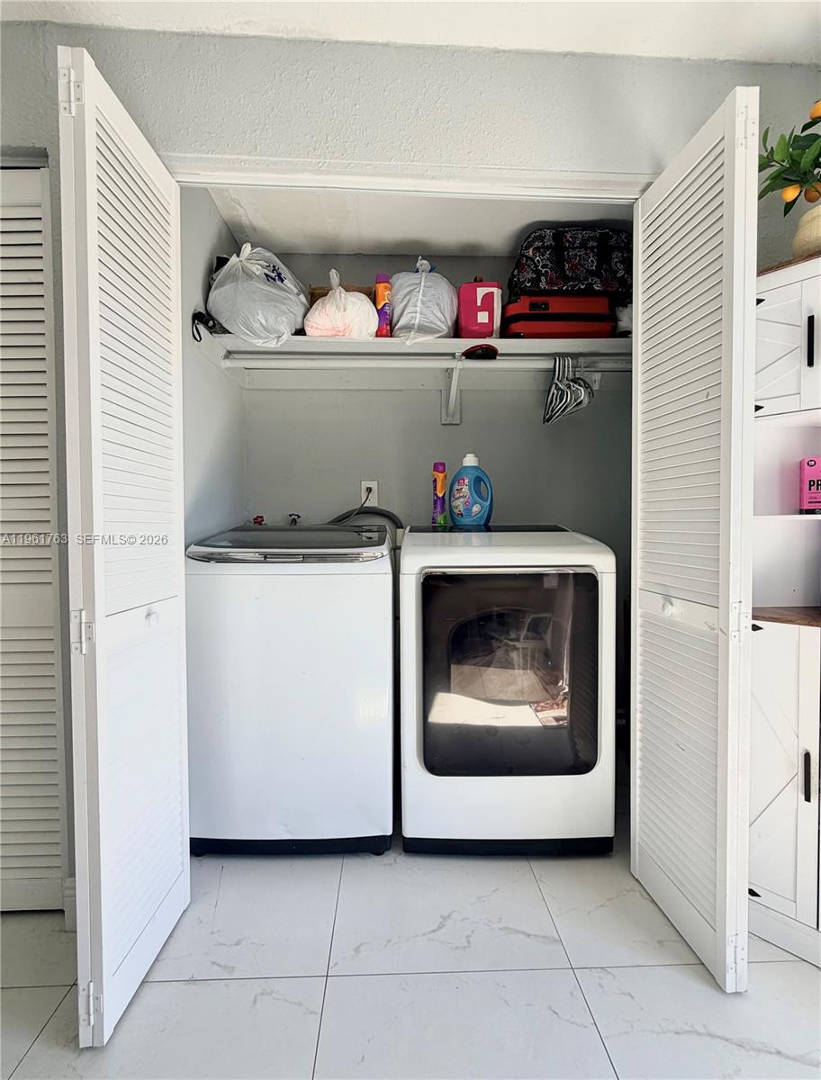 598 East 41st Street Hialeah, FL 33013 - Photo 13 of 15 a utility room with a washer and dryer
