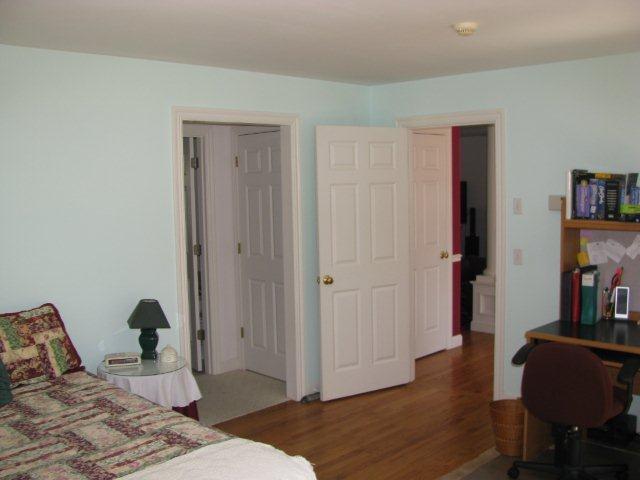 75 Jennie Clark Road Eastham, MA 02642 - Photo 15 of 23 a bedroom with a bed and wooden floor