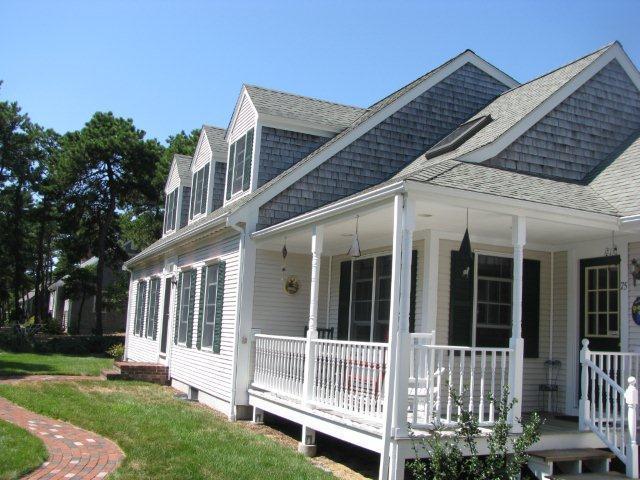 75 Jennie Clark Road Eastham, MA 02642 - Photo 3 of 23 front view of a house with a yard