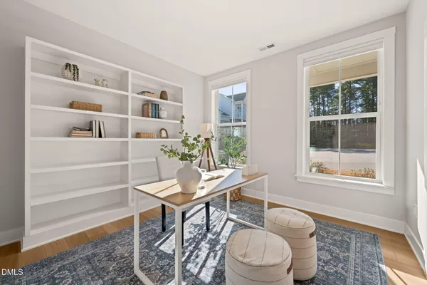 a workspace with furniture and a window