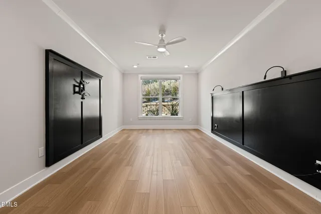wooden floor in an empty room with a window