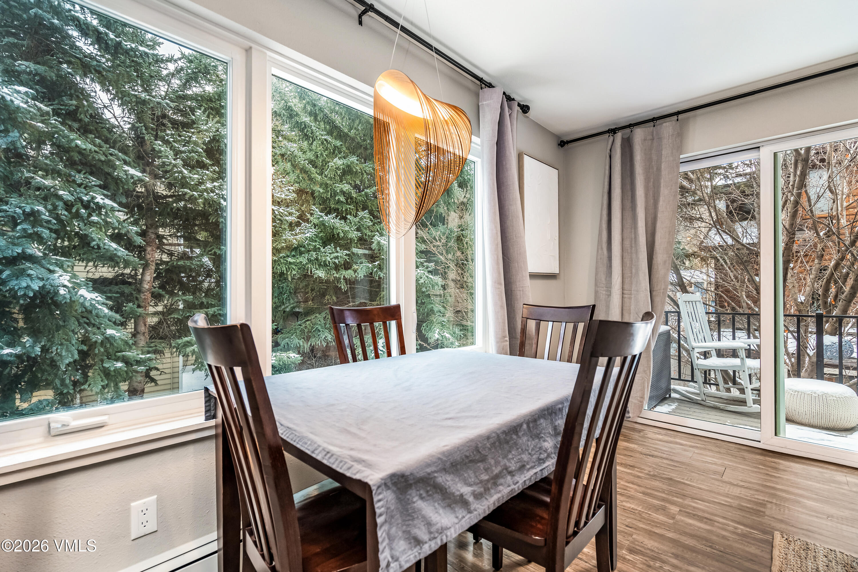 212 Eagle Road Eagle-Vail, CO 81620 - Photo 11 of 25 a view of a dining room with furniture and wooden floor