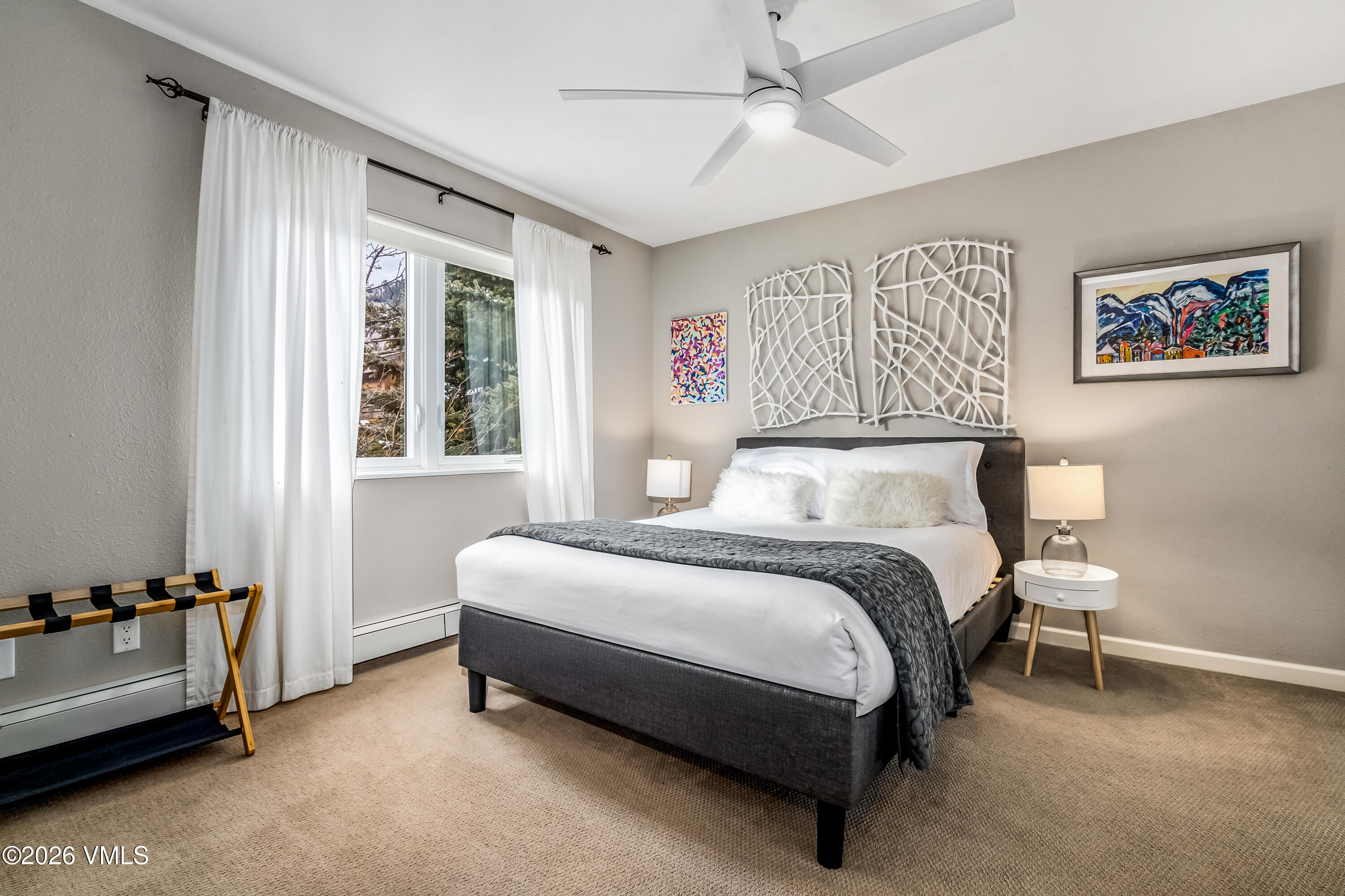 212 Eagle Road Eagle-Vail, CO 81620 - Photo 12 of 25 a spacious bedroom with a bed and a couch