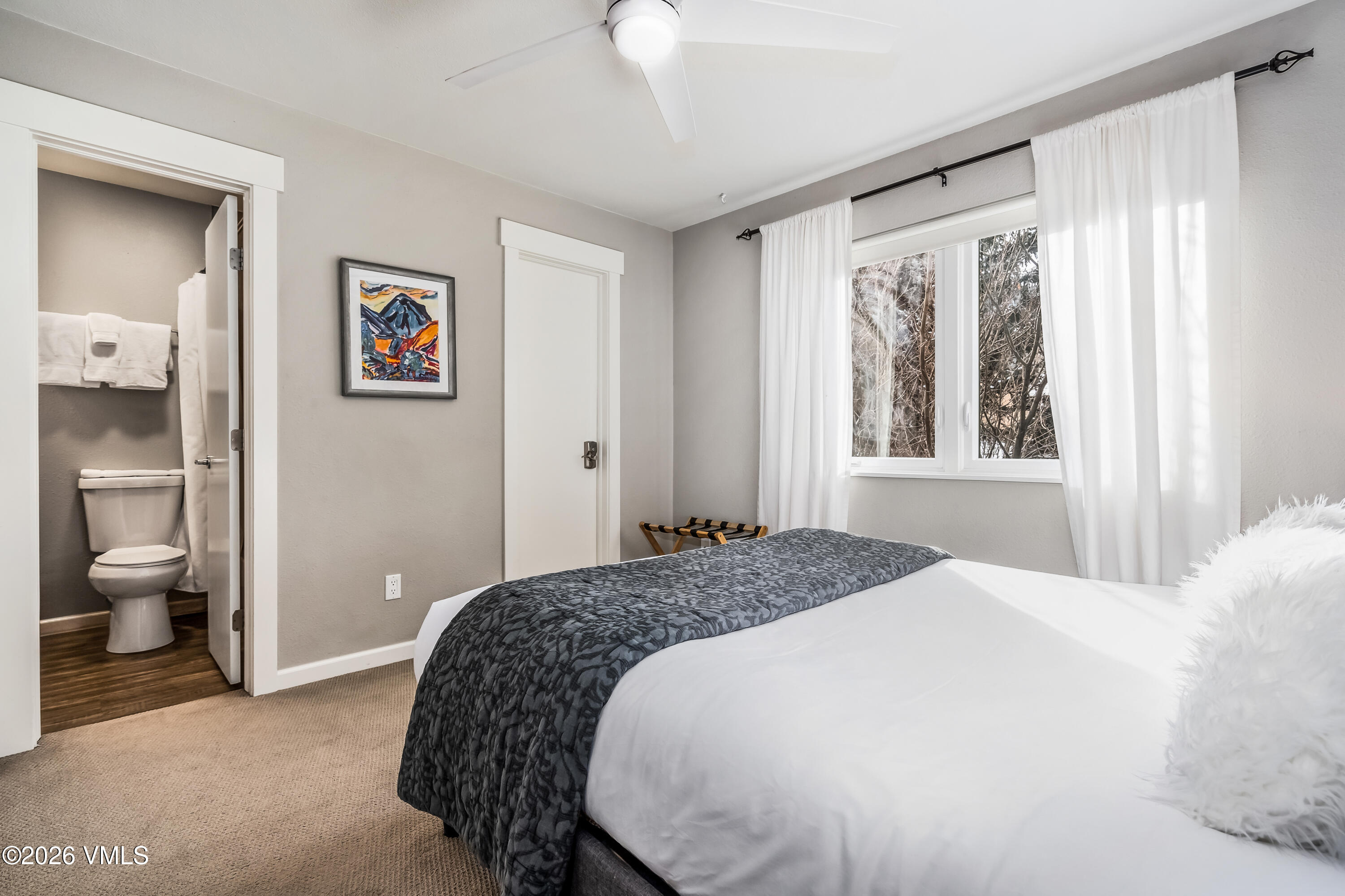 212 Eagle Road Eagle-Vail, CO 81620 - Photo 13 of 25 a bedroom with a bed and a window