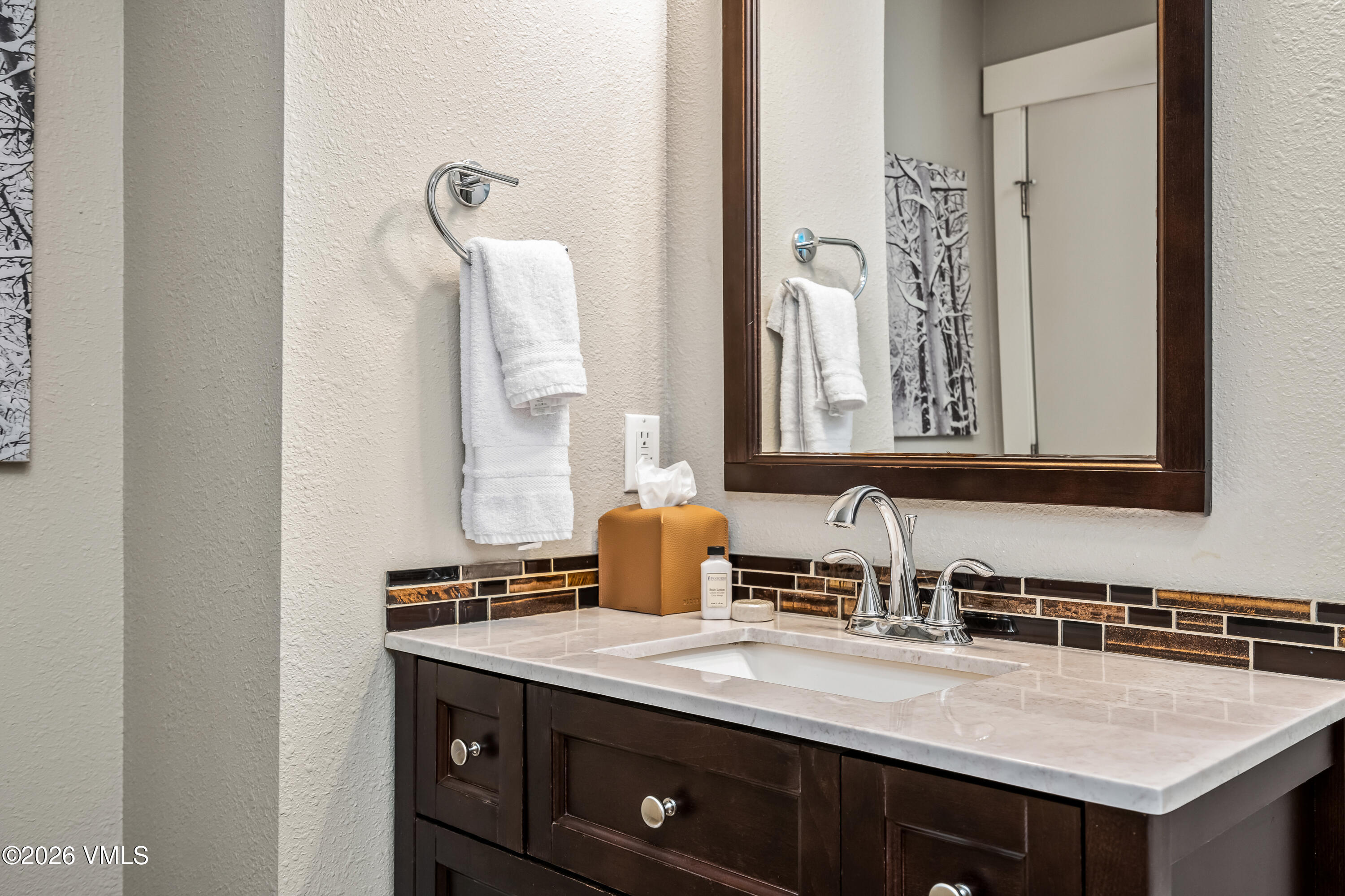212 Eagle Road Eagle-Vail, CO 81620 - Photo 15 of 25 a bathroom with a sink and a mirror