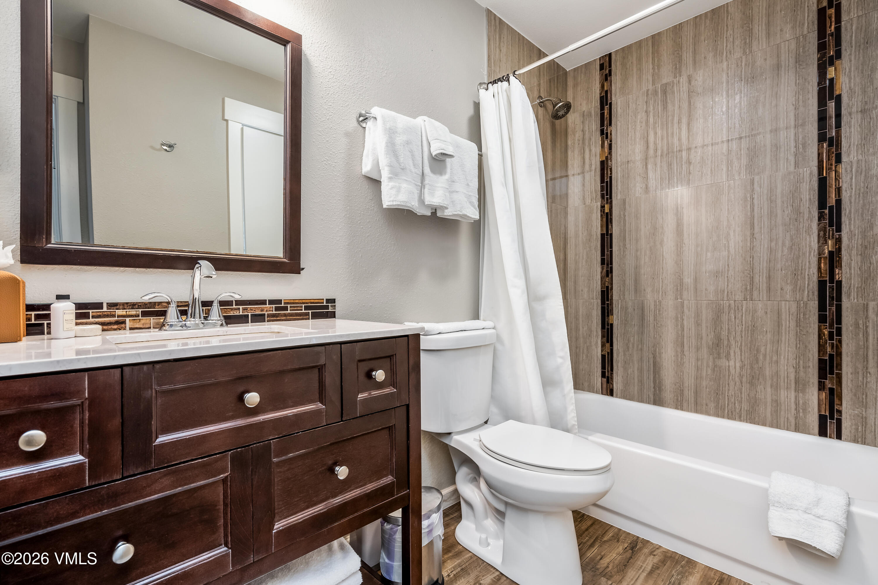 212 Eagle Road Eagle-Vail, CO 81620 - Photo 16 of 25 a bathroom with a sink a toilet and shower