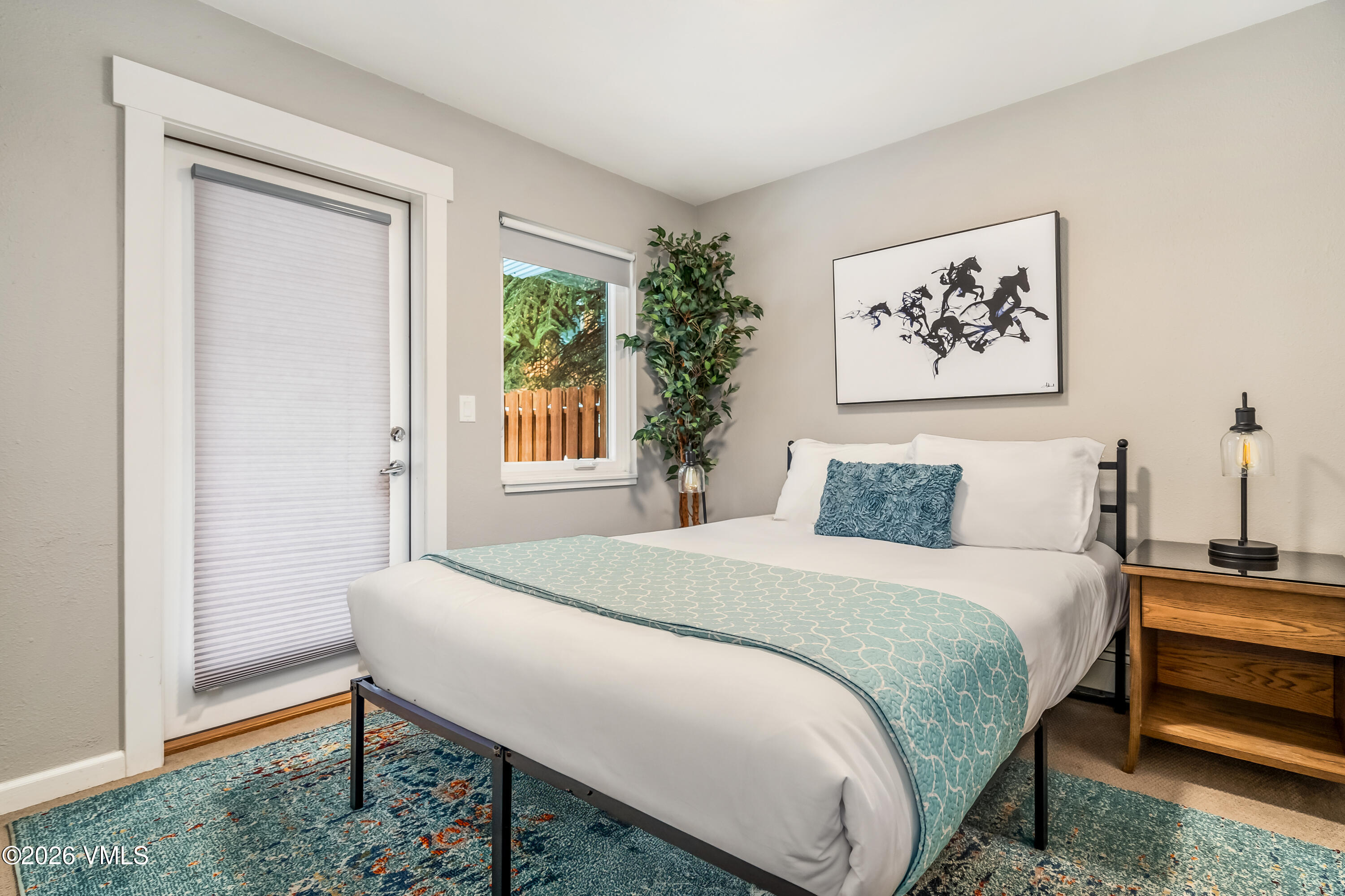 212 Eagle Road Eagle-Vail, CO 81620 - Photo 17 of 25 a bedroom with a bed and a window