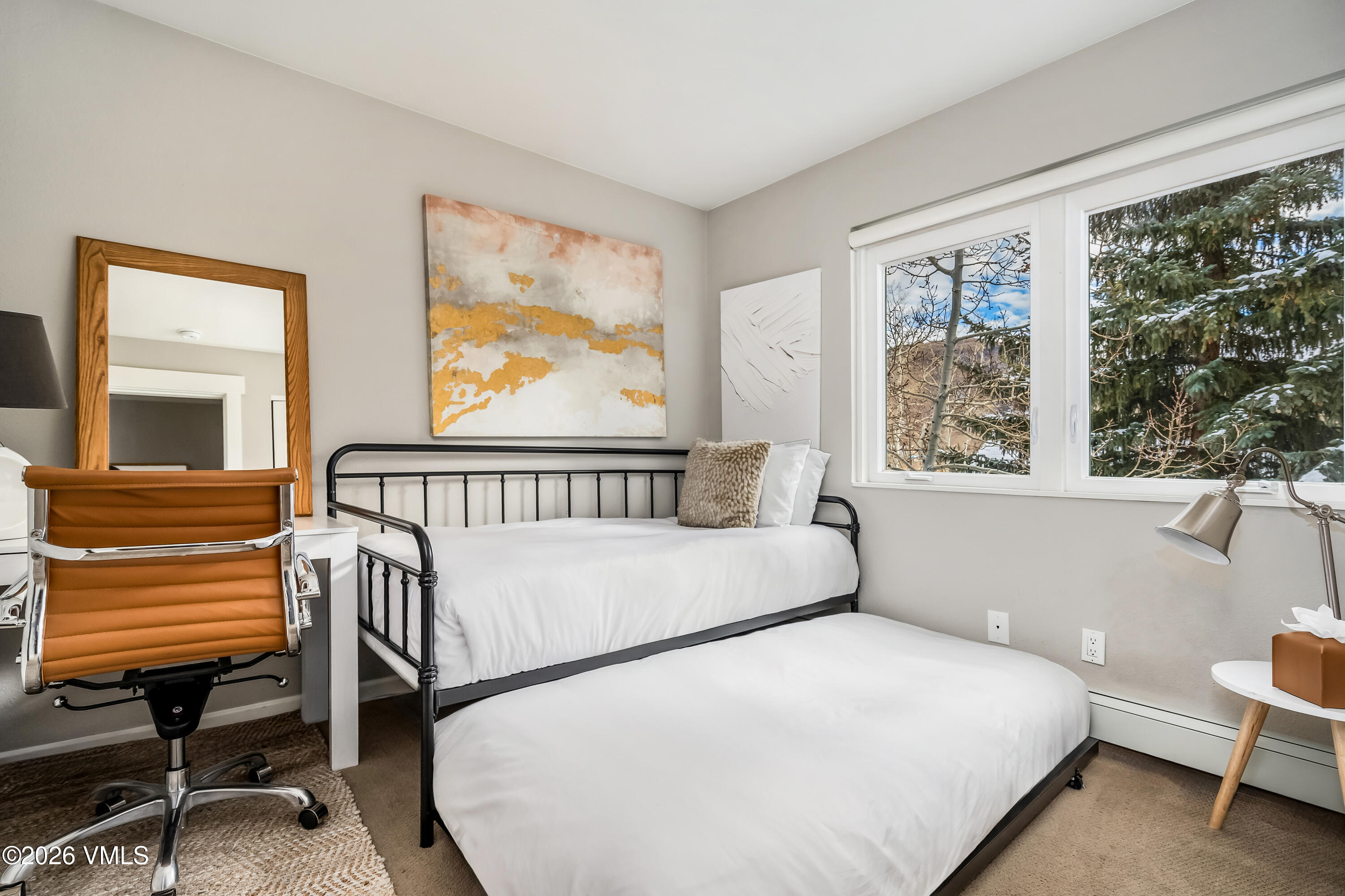 212 Eagle Road Eagle-Vail, CO 81620 - Photo 20 of 25 a bedroom with a large bed and a window