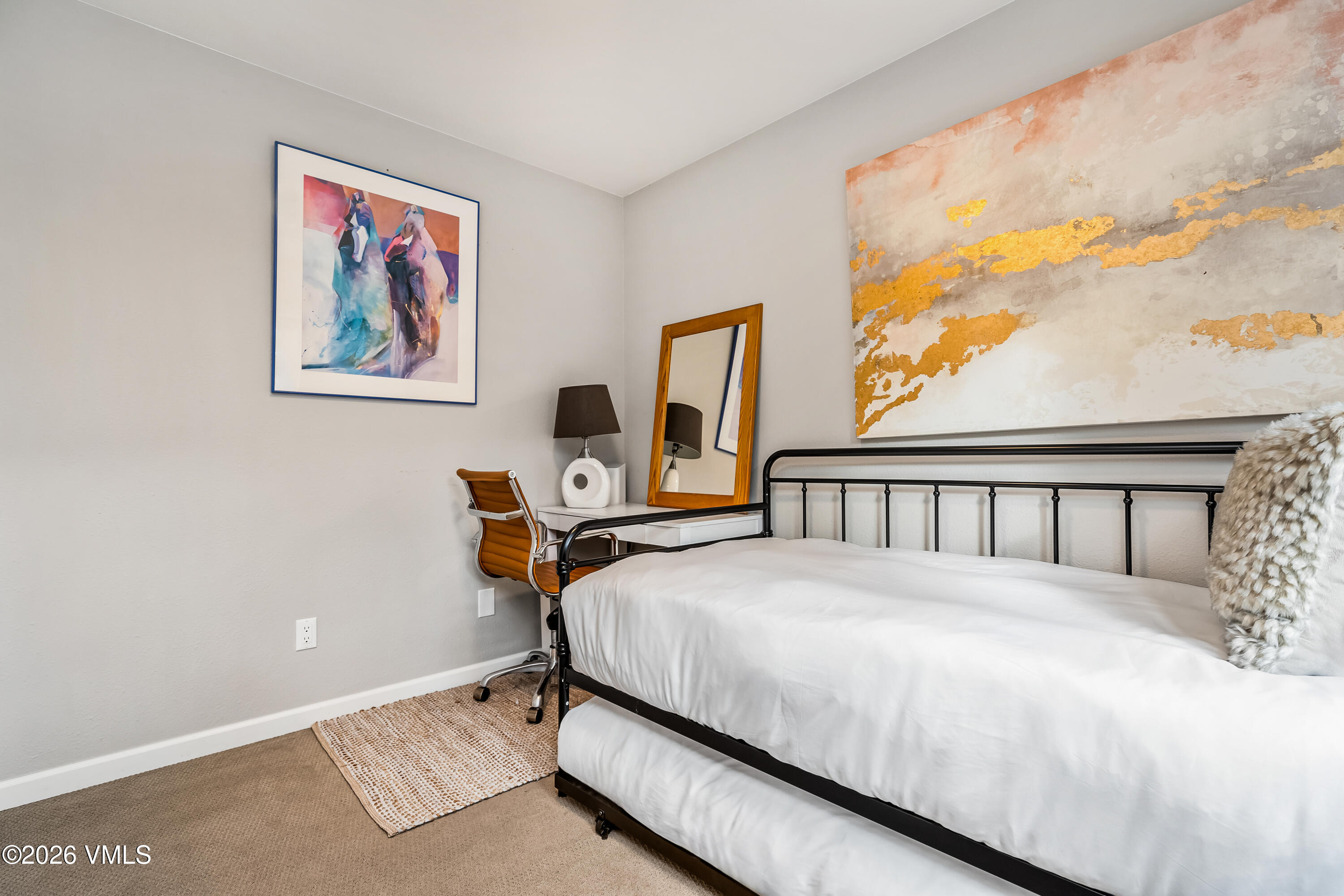 212 Eagle Road Eagle-Vail, CO 81620 - Photo 21 of 25 a bedroom with a bed next to a window