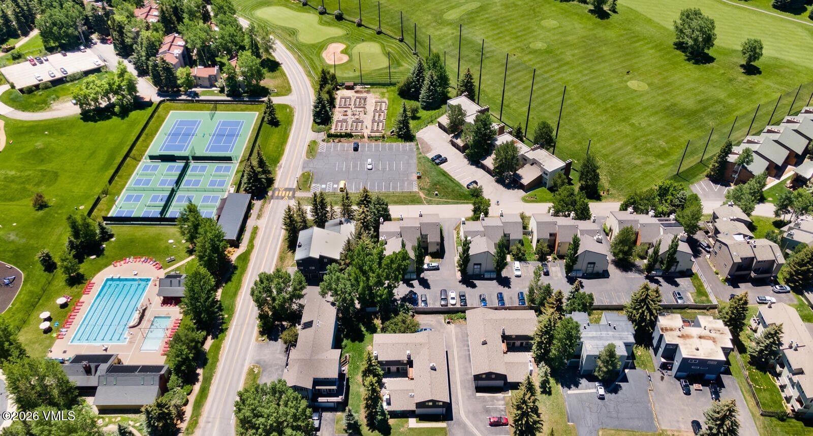 212 Eagle Road Eagle-Vail, CO 81620 - Photo 5 of 25 an aerial view of residential houses with outdoor space and parking