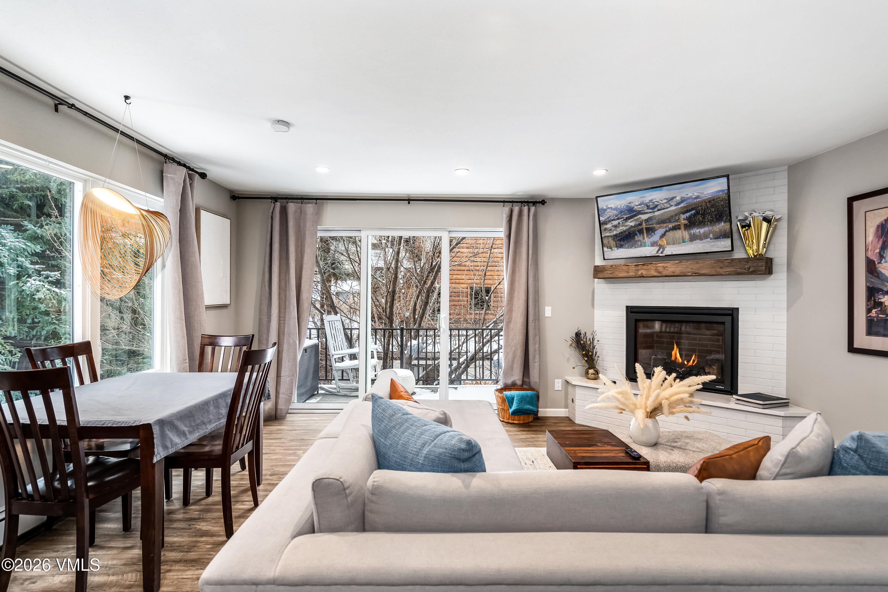 212 Eagle Road Eagle-Vail, CO 81620 - Photo 6 of 25 a living room with furniture and a large window