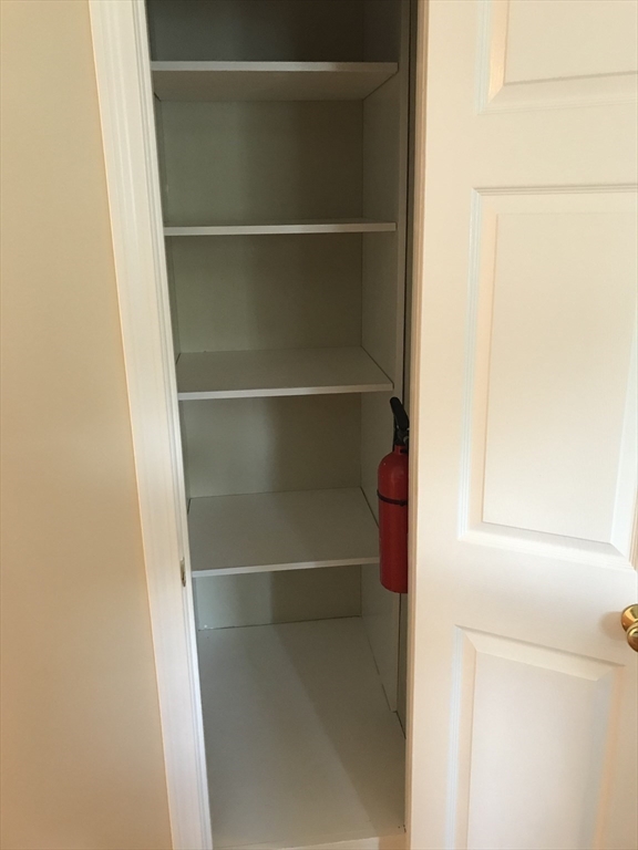 73 Broadway, Unit 3 Quincy, MA 02169 - Photo 13 of 16 a view of walk in closet with empty racks