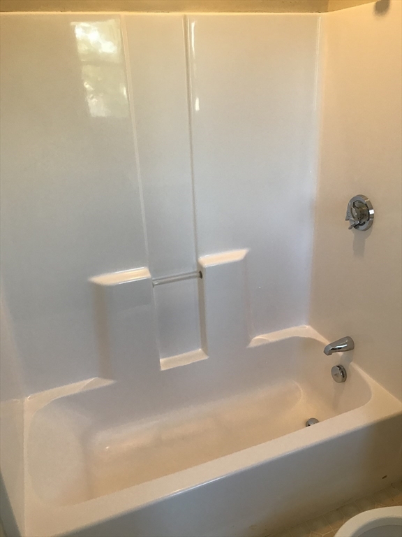 73 Broadway, Unit 3 Quincy, MA 02169 - Photo 15 of 16 a bathroom with a bathtub