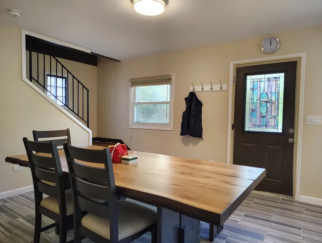 a dining room with furniture and window