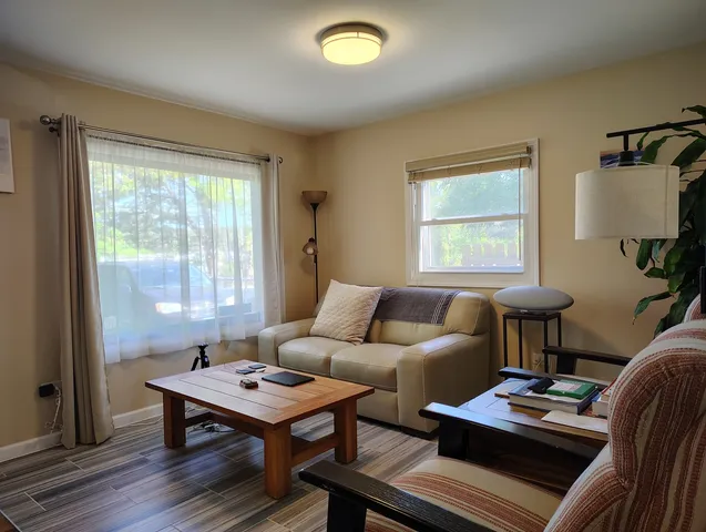a living room with furniture and a window