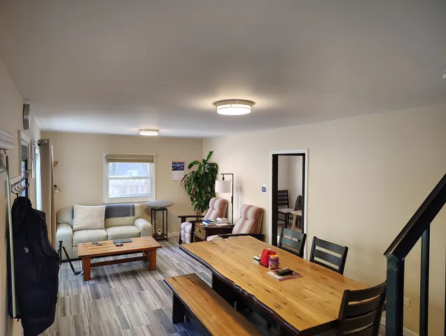 a bedroom with windows and closet