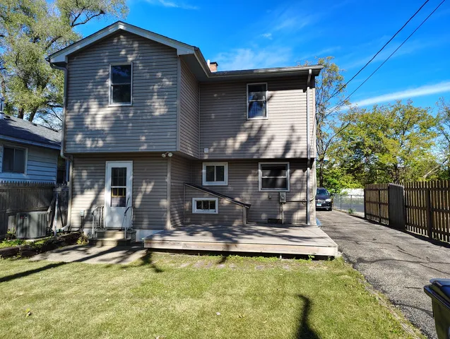 a front view of house with swimming pool and furniture