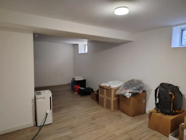 a view of a storage & utility room with wooden floor