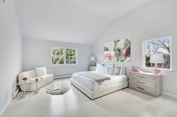 a bedroom with a bed and a couch