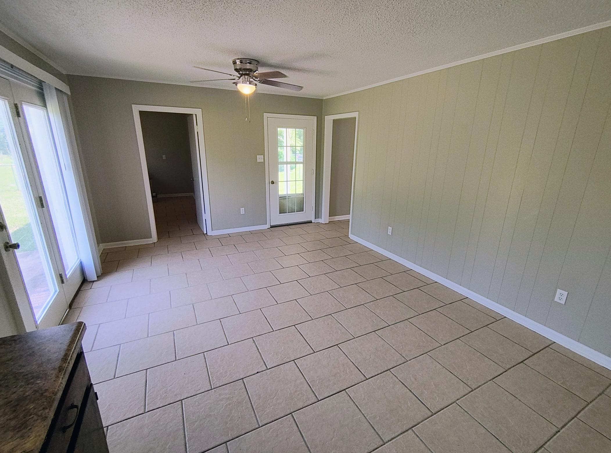 2441 Dolan Road Drummonds, TN 38023 - Photo 3 of 20 a view of an empty room with window and stairs
