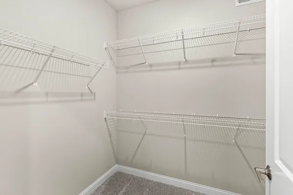 a view of a room with racks on the wall