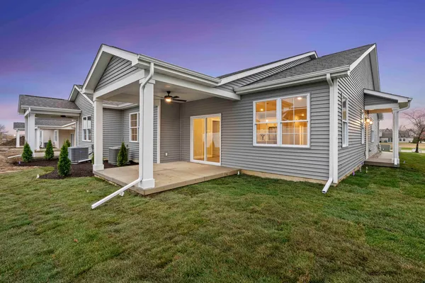 a view of house with backyard