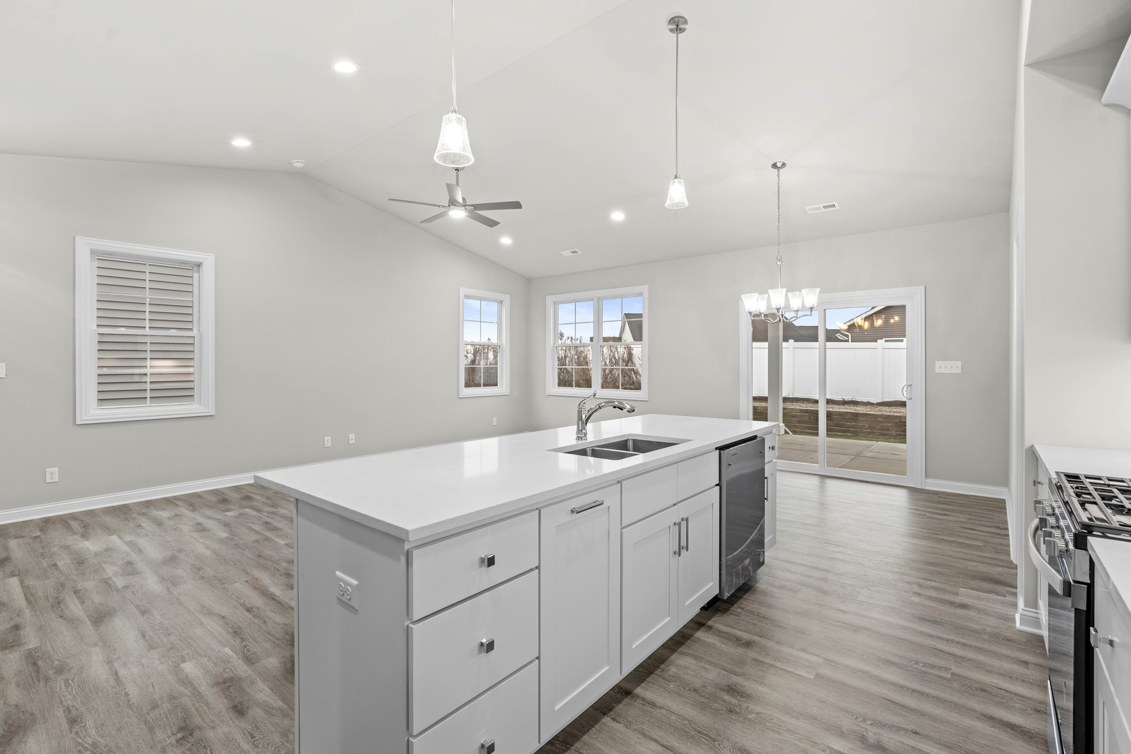6375 Jasmine Avenue Portage, IN 46368 - Photo 8 of 32 a large kitchen with kitchen island a stove a sink a center island and wooden floor