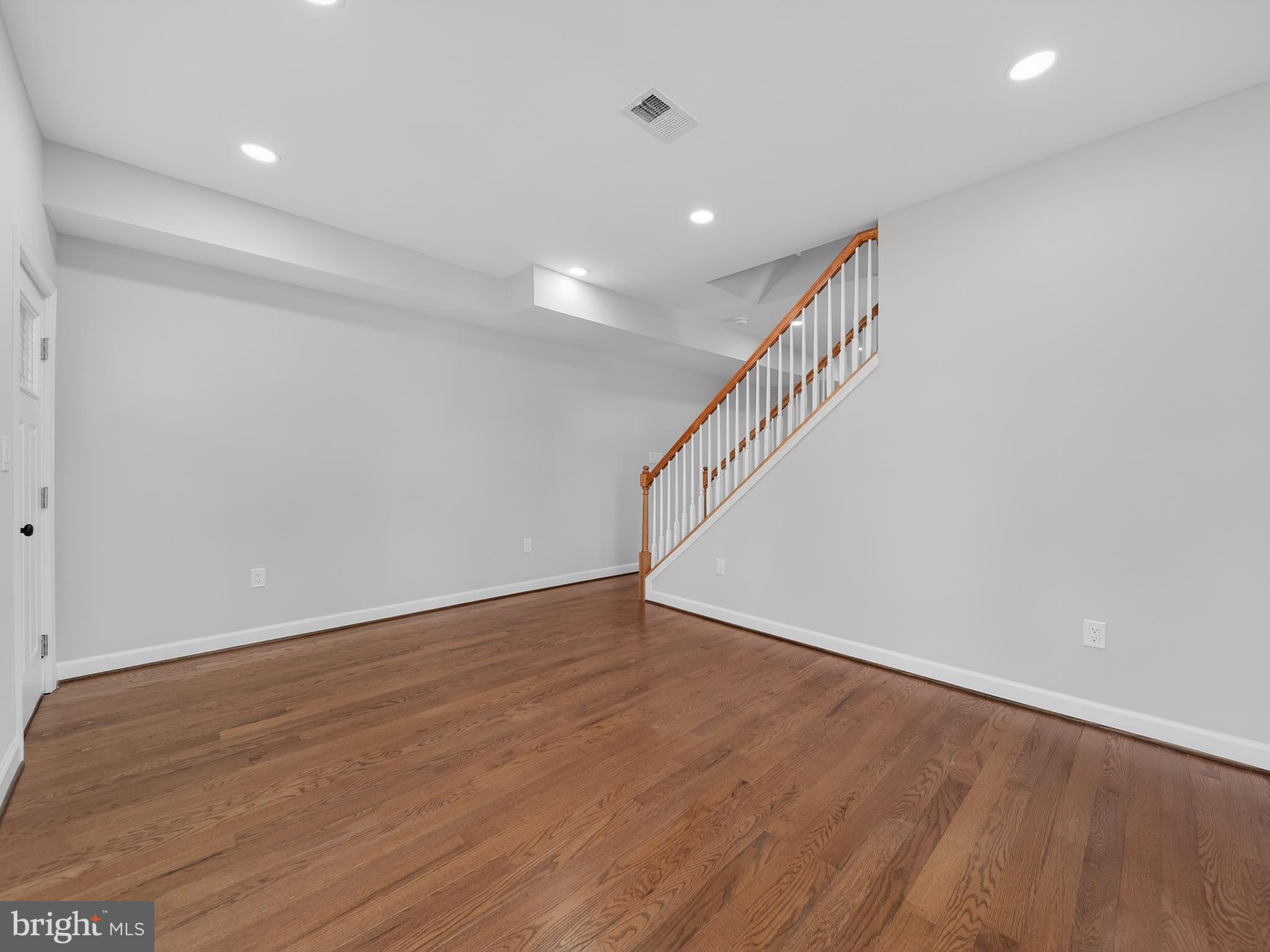 5919 Addison Road Capitol Heights, MD 20743 - Photo 12 of 40 a view of an empty room with wooden floor