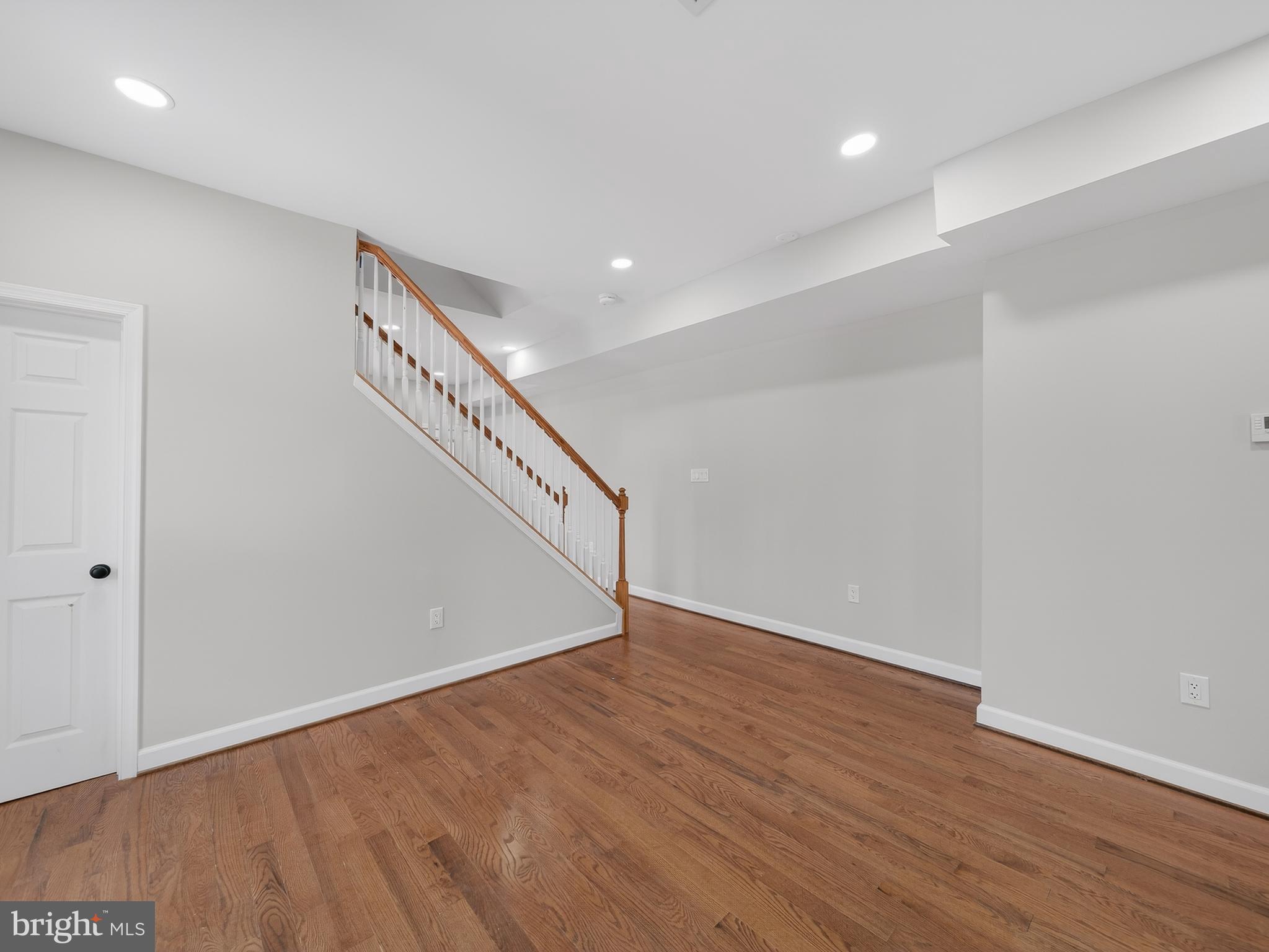 5919 Addison Road Capitol Heights, MD 20743 - Photo 14 of 40 a view of an empty room with wooden floor