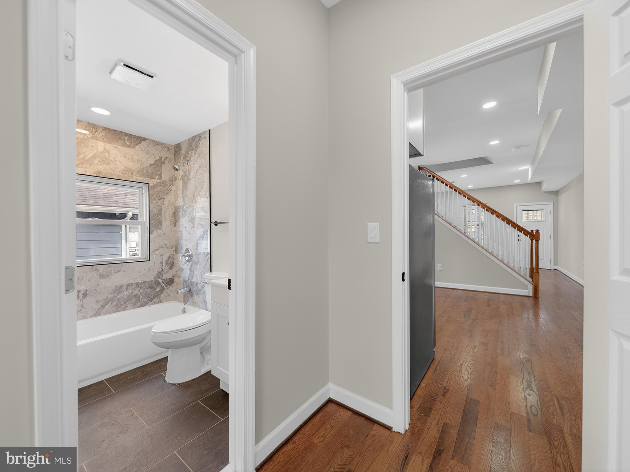 5919 Addison Road Capitol Heights, MD 20743 - Photo 17 of 40 a bathroom with a sink a toilet and shower