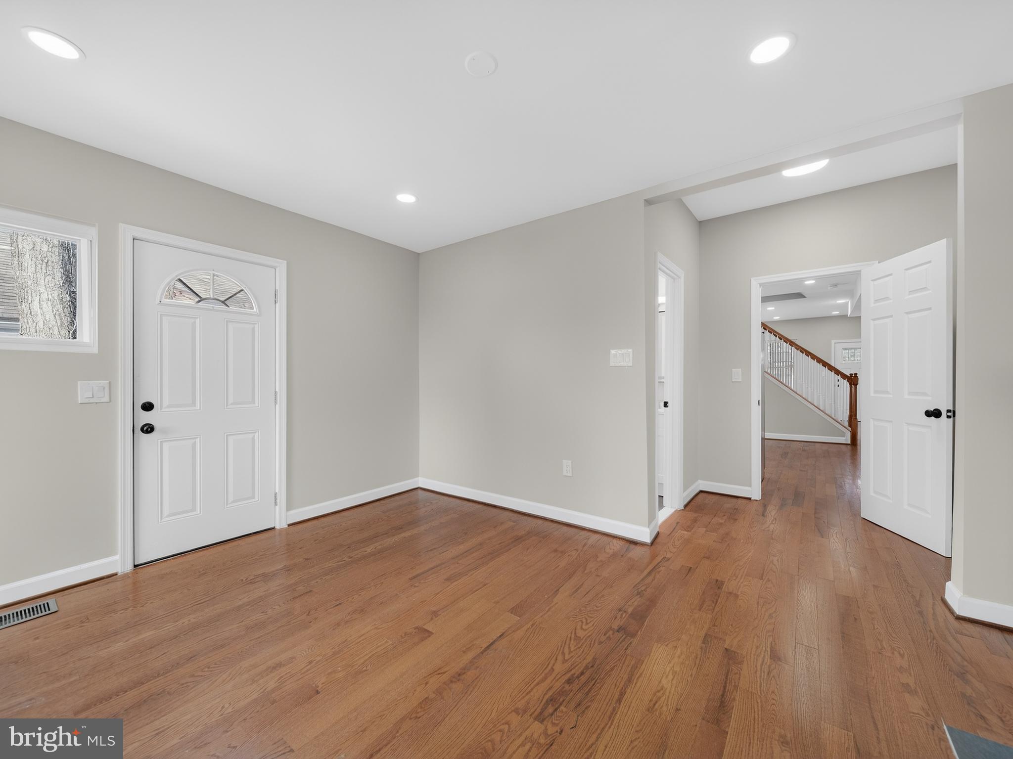 5919 Addison Road Capitol Heights, MD 20743 - Photo 18 of 40 a view of an empty room with wooden floor