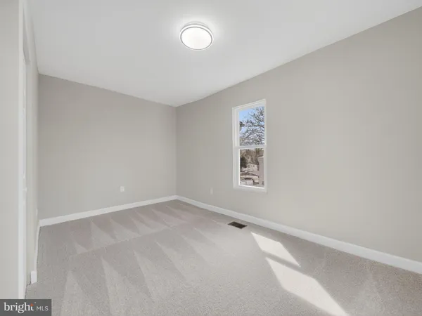 an empty room with a empty space and window