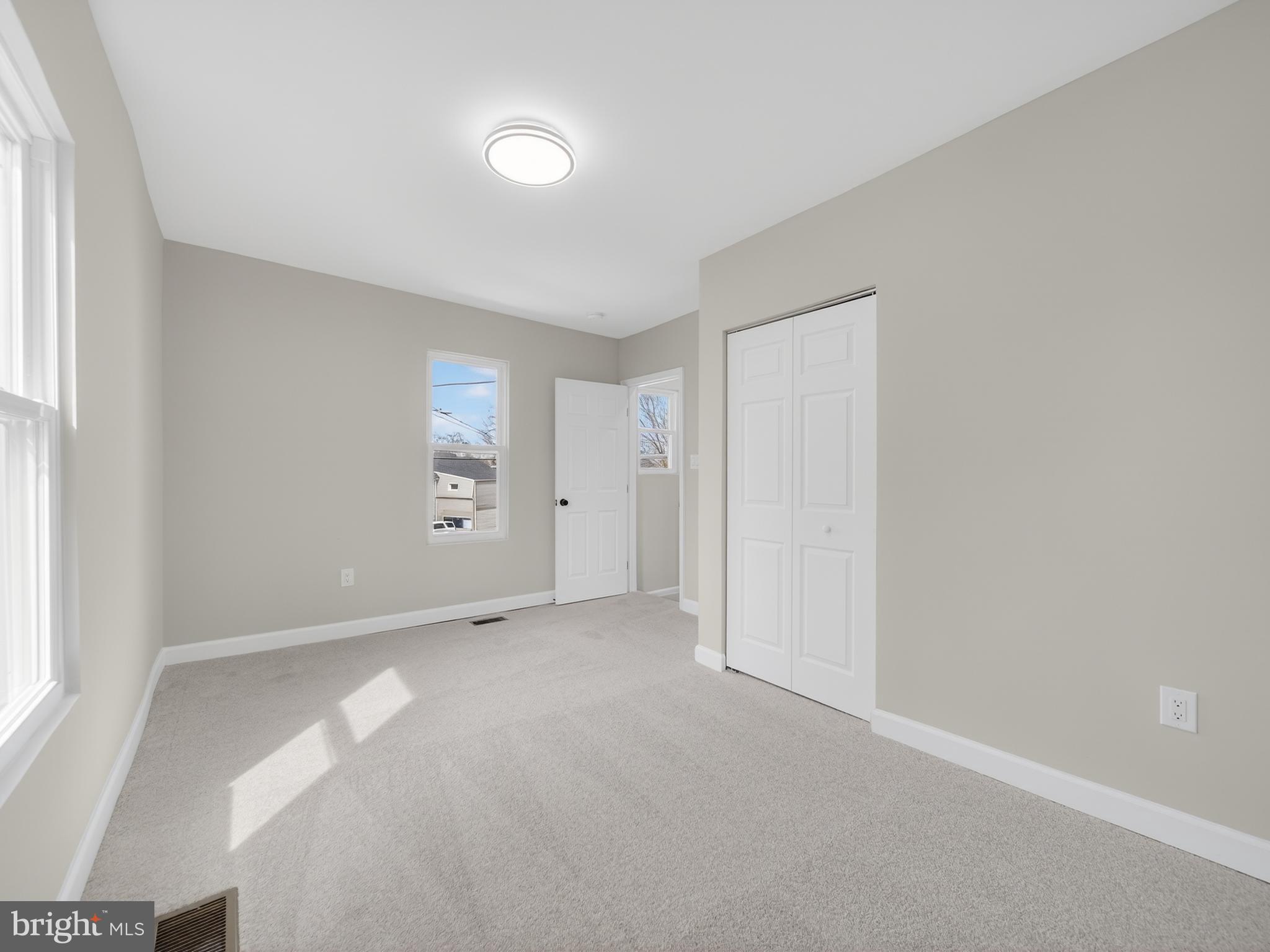 5919 Addison Road Capitol Heights, MD 20743 - Photo 23 of 40 an empty room with a natural light