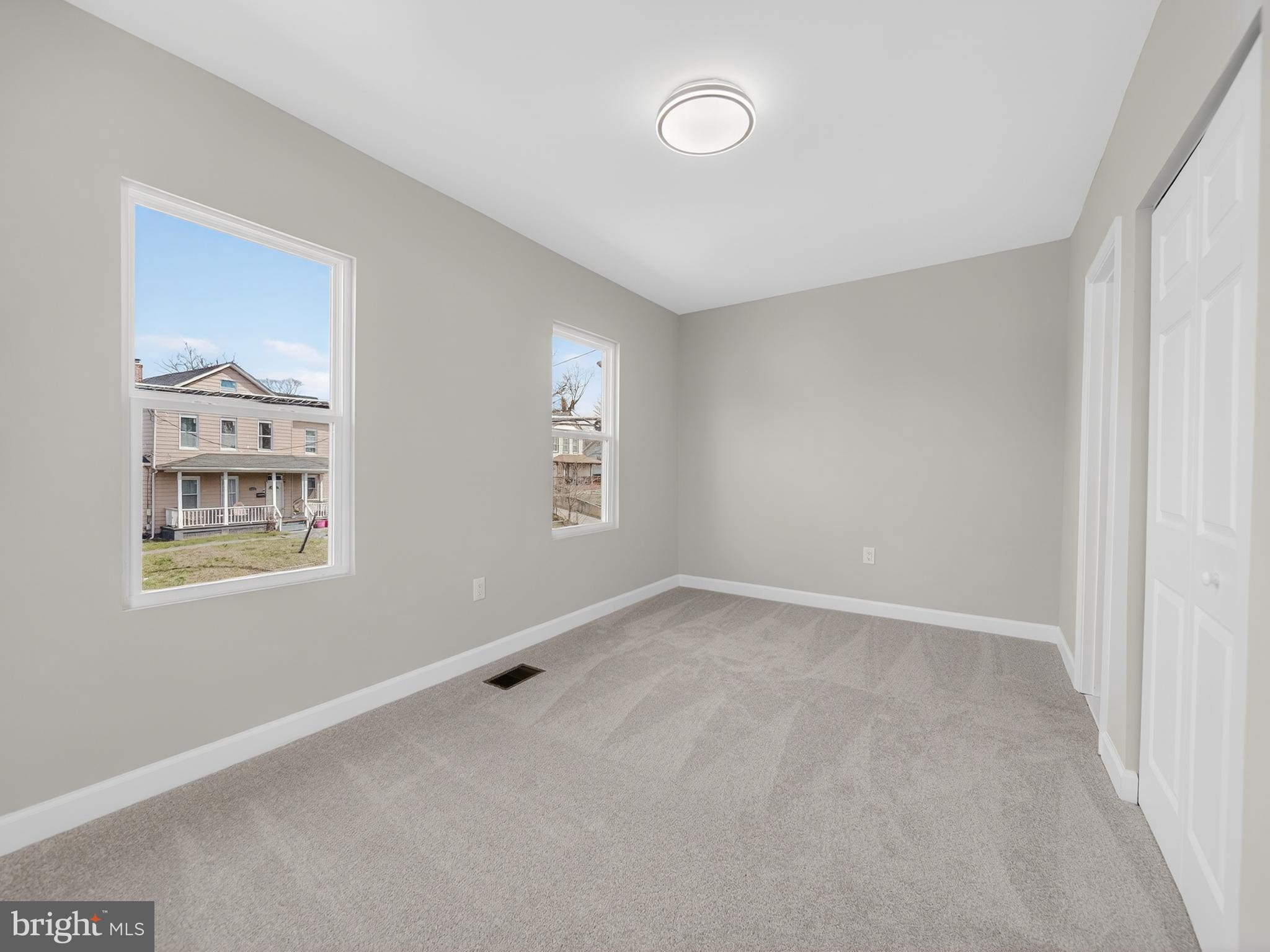 5919 Addison Road Capitol Heights, MD 20743 - Photo 26 of 40 an empty room with windows